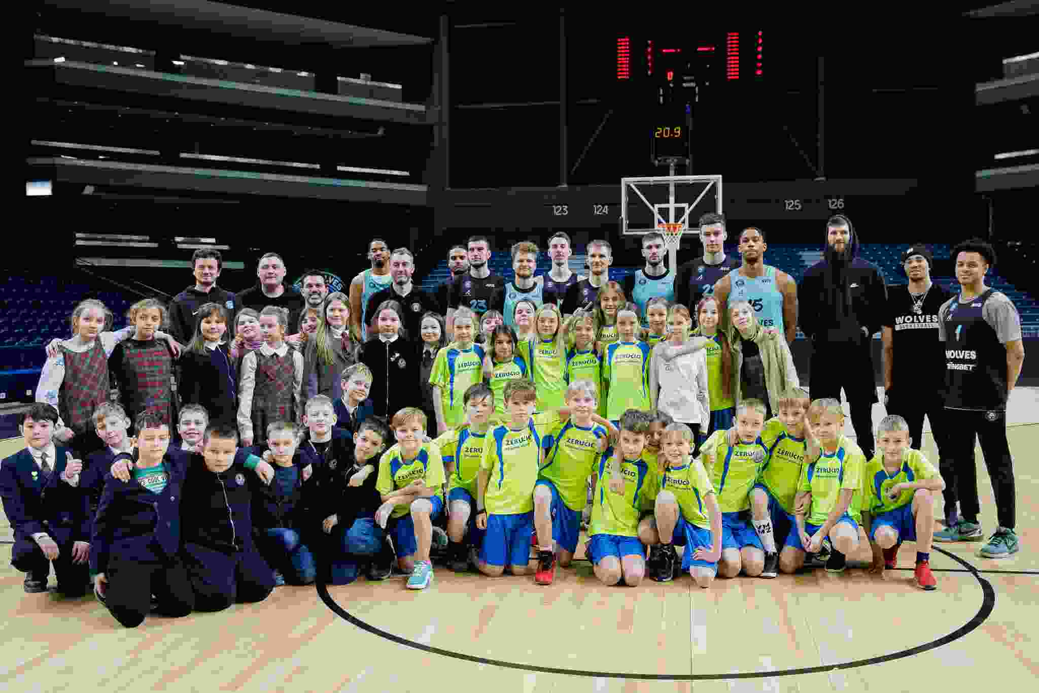 Winners of the poster drawing contest attended the Wolves Twinsbet practice